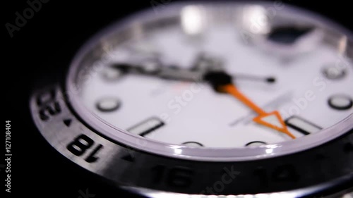 Extreme close-up of white luxury watch in a watch winder