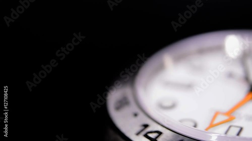 Extreme close-up of white luxury watch in a watch winder