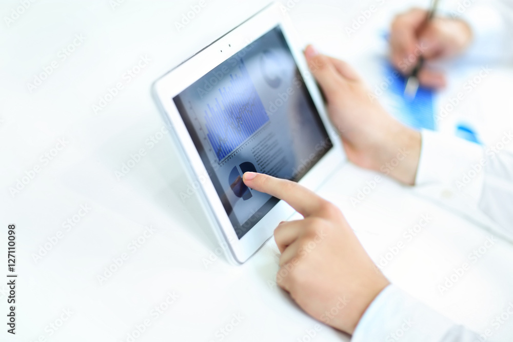 businessman studying Finance data on your tablet businessman studying Finance data on your tablet