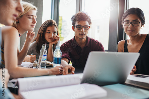 Students studying in university library