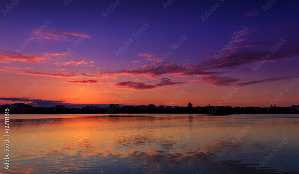 fantastic landscape, colorful sky over the lake. majestic sunrise. use as background. color in nature. beautiful in nature. series . creative images.
