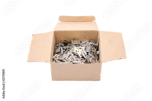 Cardboard box with metal detail, isolated on white background.