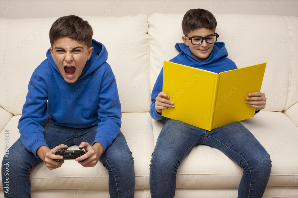 same child reads and plays with videogame same child reads and plays with videogame