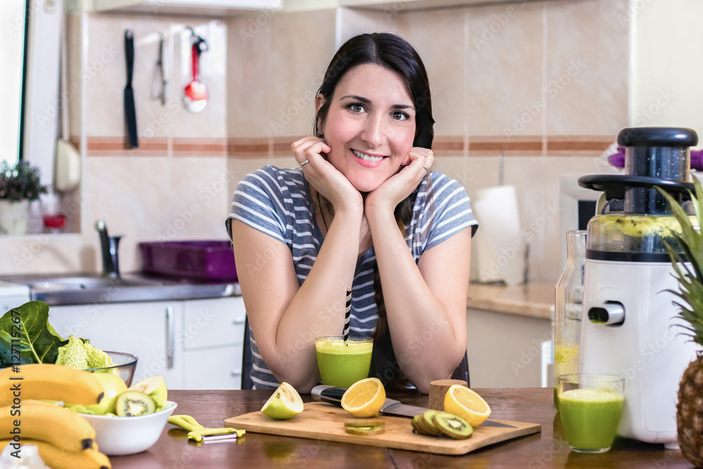 Healthy Eating. Portrait Of Young Beautiful Vegetarian Woman Preparing A Green Detox Juice At Home In The Kitchen. Dieting, Diet, Raw Food, Lifestyle Concept.