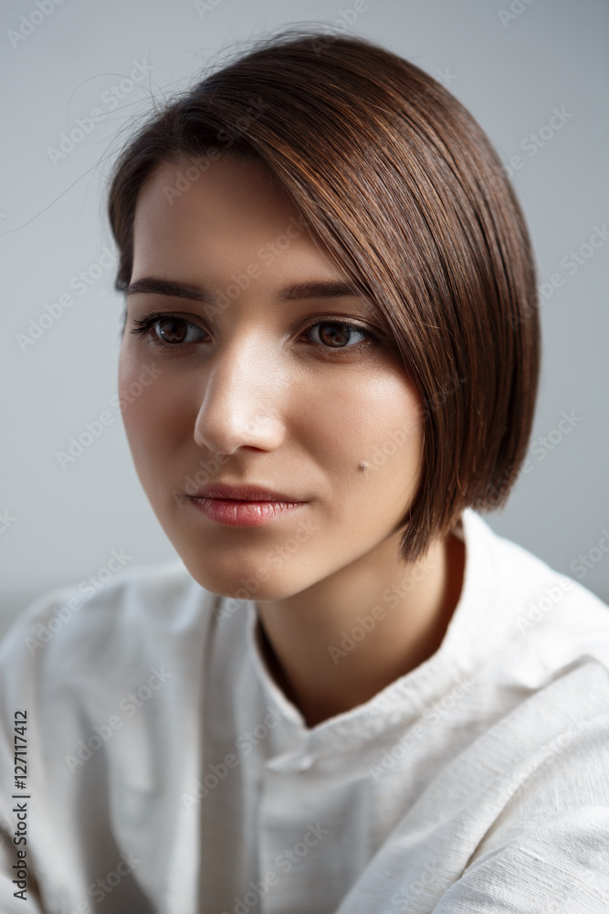 Portrait of young beautiful girl smiling over white background. Portrait of young beautiful girl smiling over white background.