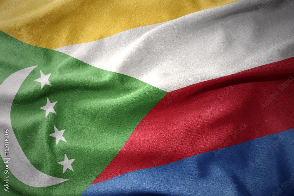 Obraz premium waving colorful flag of comoros.