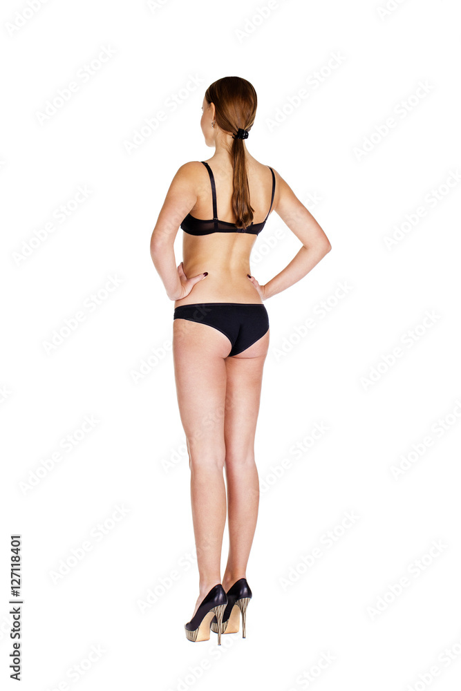 Full length portrait of young woman wearing black underwear