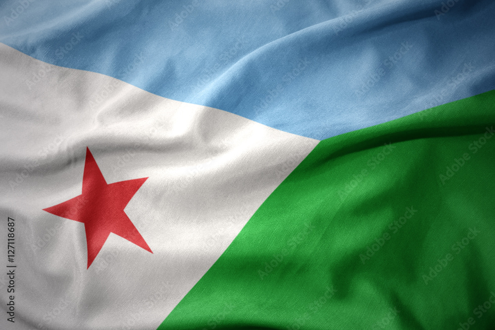 Naklejka premium waving colorful flag of djibouti.
