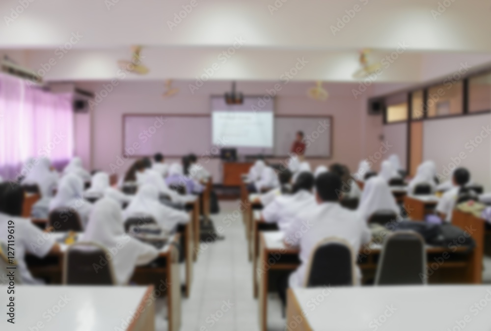 blurred focus, students sitting in a lecture room with the teacher blurred focus, students sitting in a lecture room with the teacher
