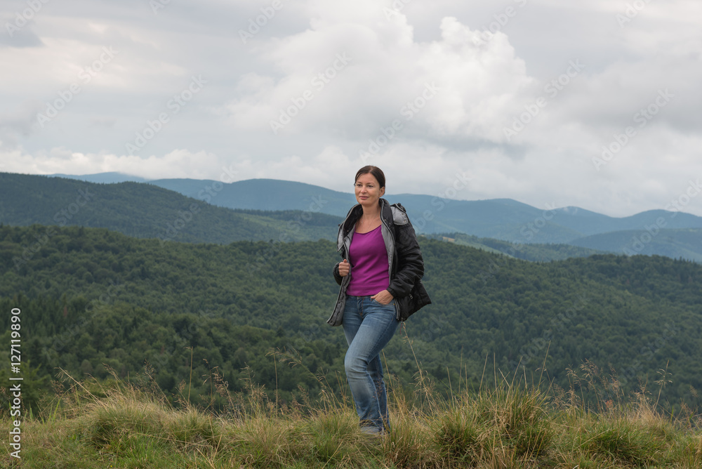 Woman in mountains Carpathians. Ukraine. 
