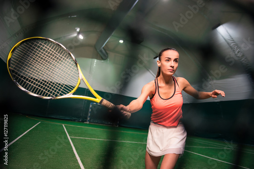 Serious young woman playing tennis © Viacheslav Yakobchuk