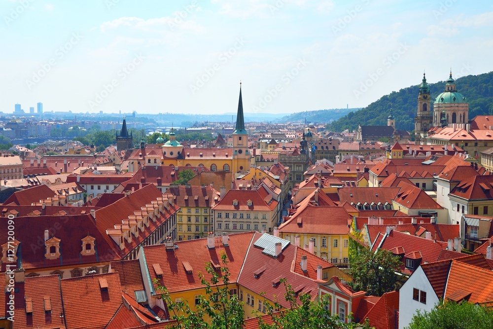 Fototapeta premium Red roofs of old Prague, a view from the castle