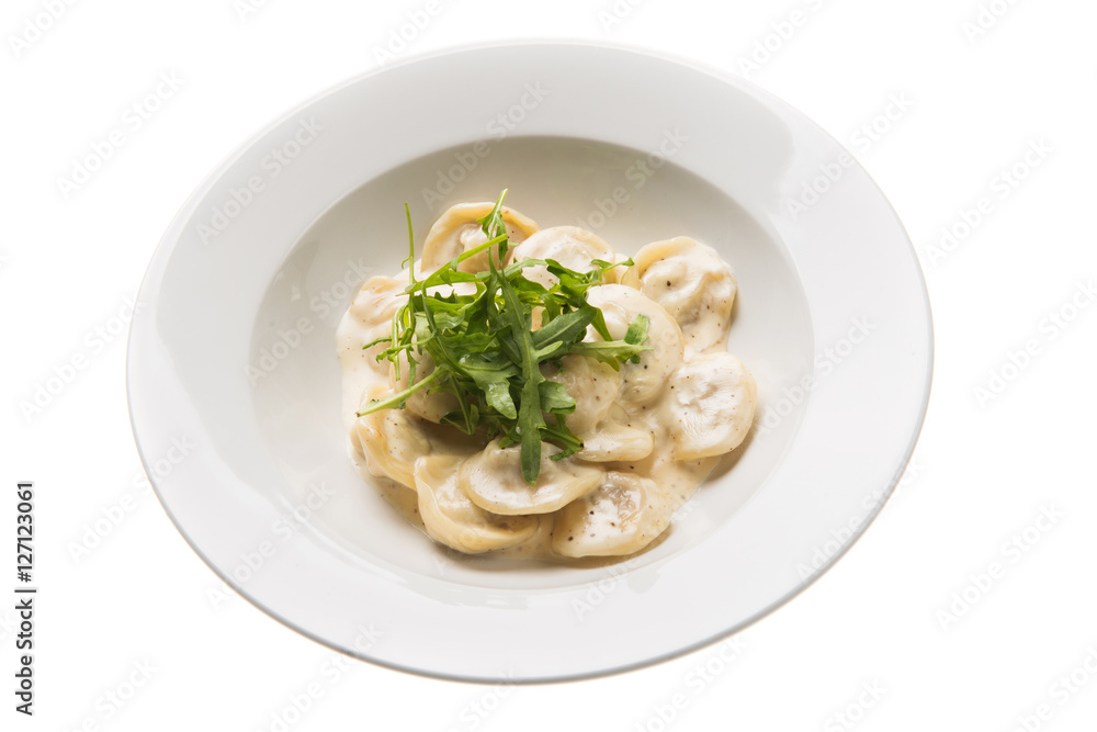 Italian gnocchi with gorgonzola cheese and arugula isolated on white Italian gnocchi with gorgonzola cheese and arugula isolated on white