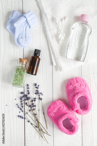 Natural organic cosmetics for baby with lavender on wooden background
