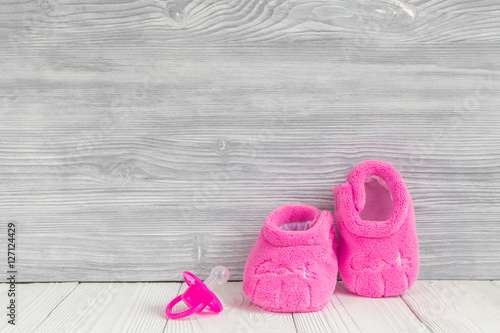 pink booties on wooden background © 279photo