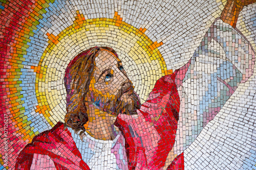 MEDJUGORJE, BOSNIA AND HERZEGOVINA, 2016/11/11. Mosaic of Jesus Christ proclaiming the kingdom of God with his call to conversion. The third luminous mystery of the rosary. photo