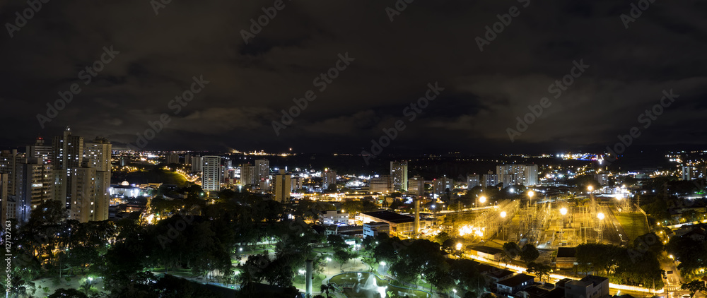 Panoramic night photo of the city Sao Jose dos Campos - Sao Paulo, Brazil - with cloudy sky