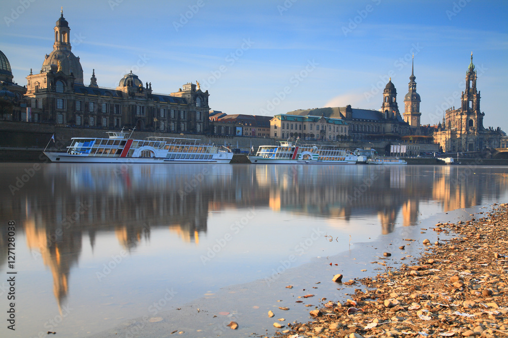 Skyline of Dresden with Elbe river, passenger ships and In background the Frauenkirche at sunrise