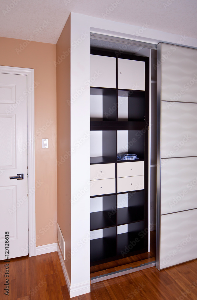 Built-in closet with sliding door shelving storage organization Built-in closet with sliding door shelving storage organization