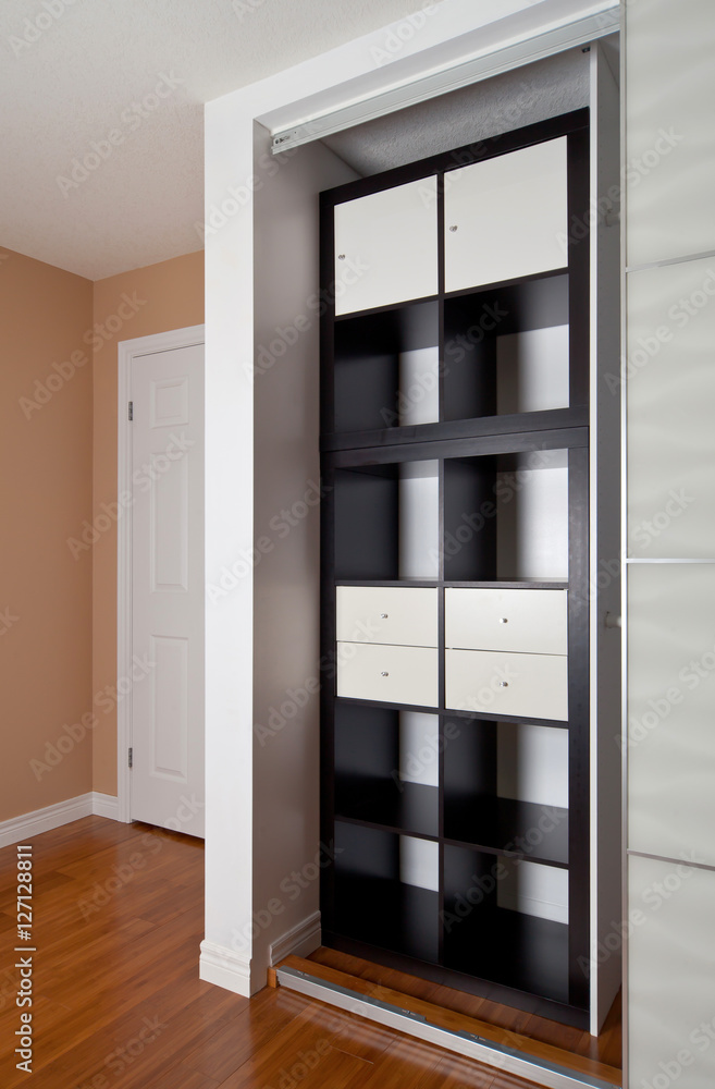 Built-in closet with sliding door shelving storage organization