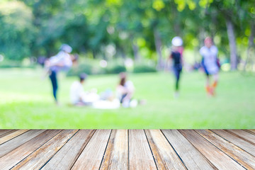 Perspective wood and blurred people activities in park background