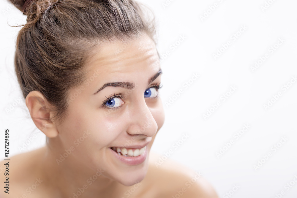 Portrait of a beautiful happy young woman with magical blue color of eyes Portrait of a beautiful happy young woman with magical blue color of eyes