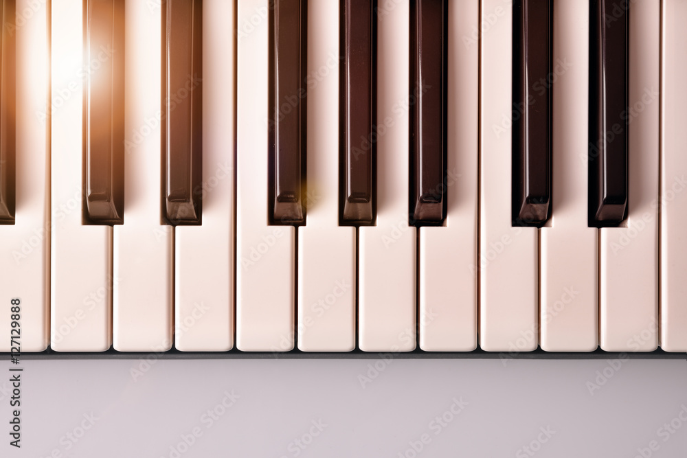 Piano keyboard with golden shine top view Piano keyboard with golden shine top view