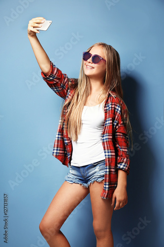 Cute teenager girl in sungl...