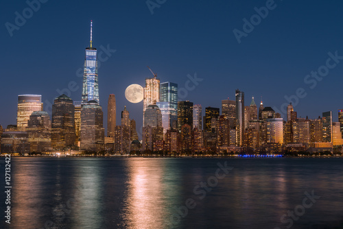 Perigee full moon over the skyscrapers of lower Manhattan-New Yo