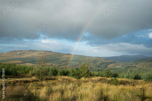 Perfect rainbow over mountains of Gortin Glen Park