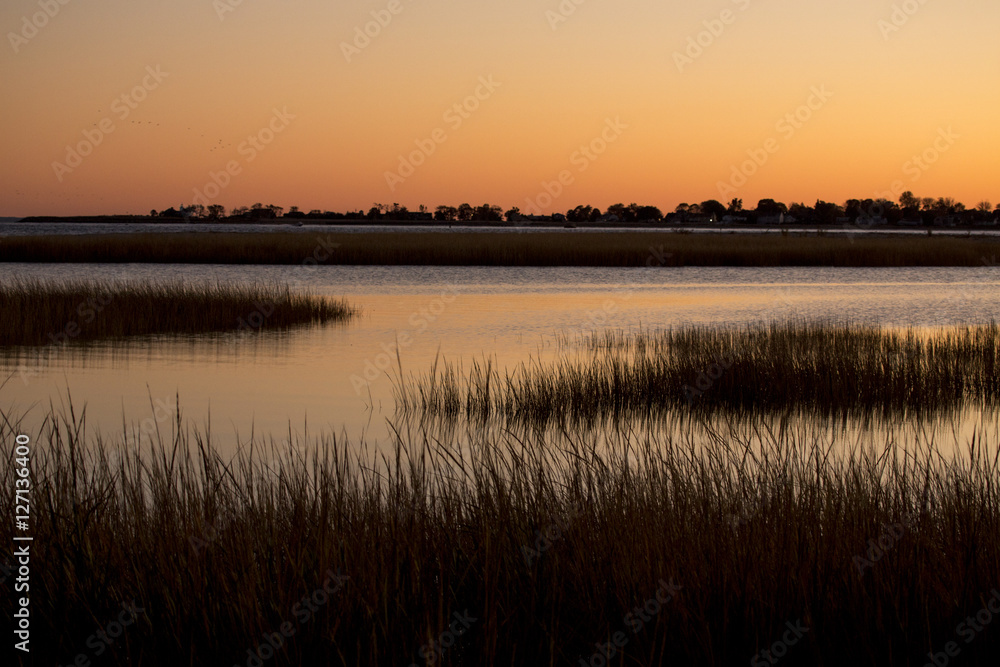 Warm sky over a marsh at Milford Point, Connecticut.