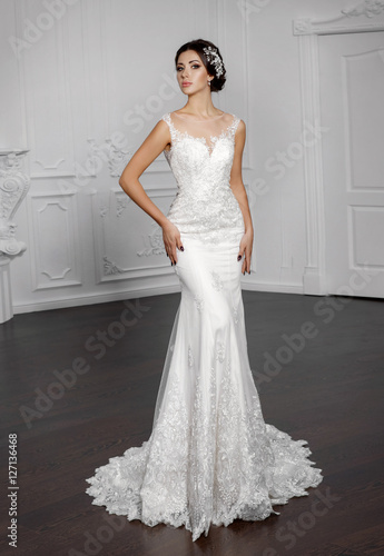 Beautiful bride in fashion wedding dress with diamond jewelry 