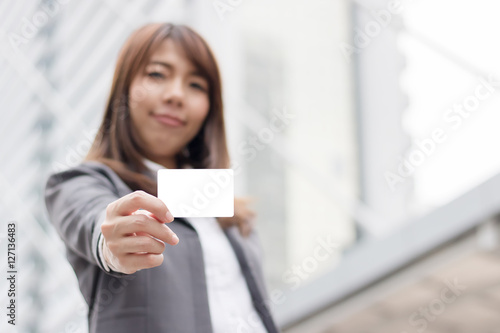 Businesswoman are showind empty white card