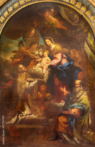 ROME, ITALY - MARCH 12, 2016: The painting of Madonna with the st. Philip Neri and st. Nicholas in church Basilica di San Lorenzo in Damaso by Sebastiano Conca (1743).
