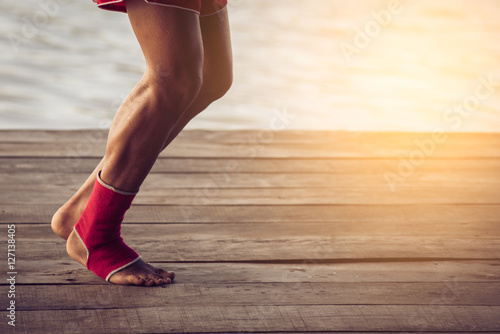Feet of jogging man. Vintage tinted image