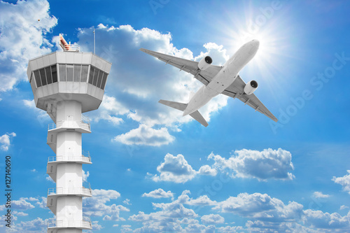  Passenger aircraft  flying above air traffic control tower agai