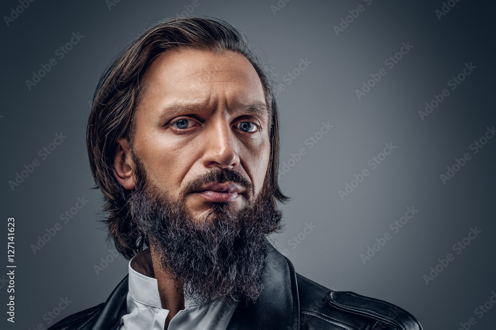 Portrait bearded male on grey background. Portrait bearded male on grey background.