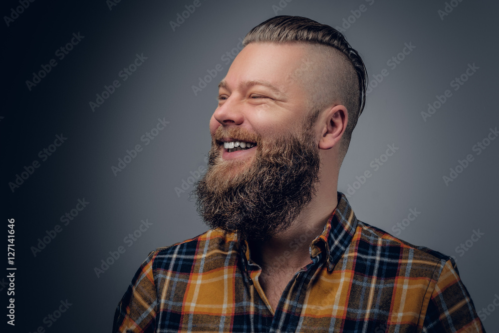 Fototapeta premium Laughing bearded male in yellow shirt.