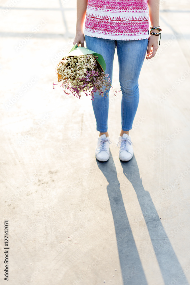 Young Woman Holding Flowers Concept