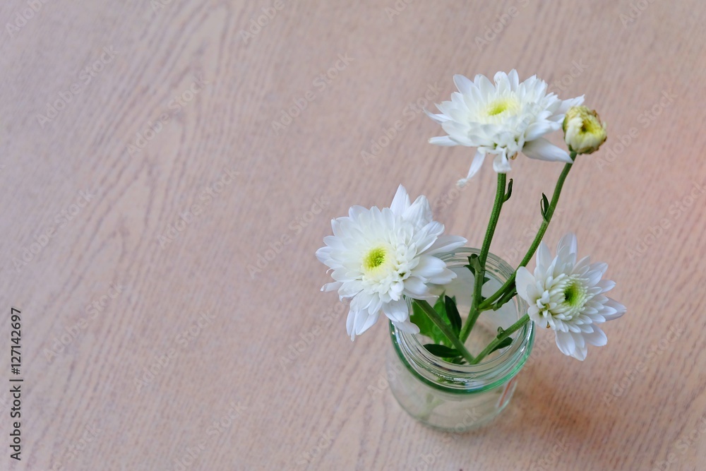 custom made wallpaper toronto digitalSoft focus and blurry Top view White flowers in a glass vase  on wooden background. retro and vintage tone, hipster style.