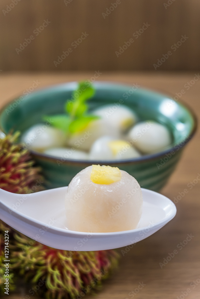 Peeled rambutan stuffed with pineapple in syrup. Peeled rambutan stuffed with pineapple in syrup.