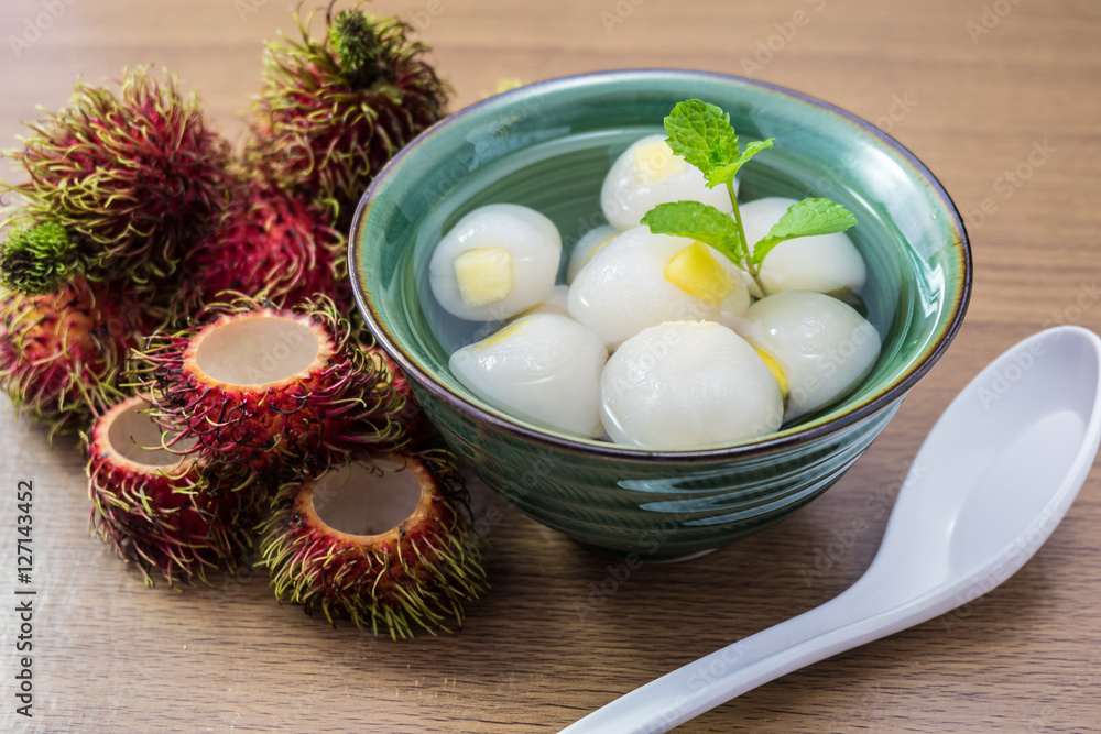 Peeled rambutan stuffed with pineapple in syrup. Peeled rambutan stuffed with pineapple in syrup.