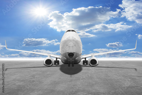 Fotografie Passenger aircraft against blue sky background