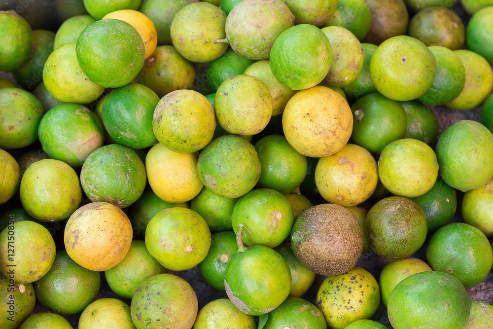 Fresh green lemons and limes for making Fresh green lemons and limes for making
