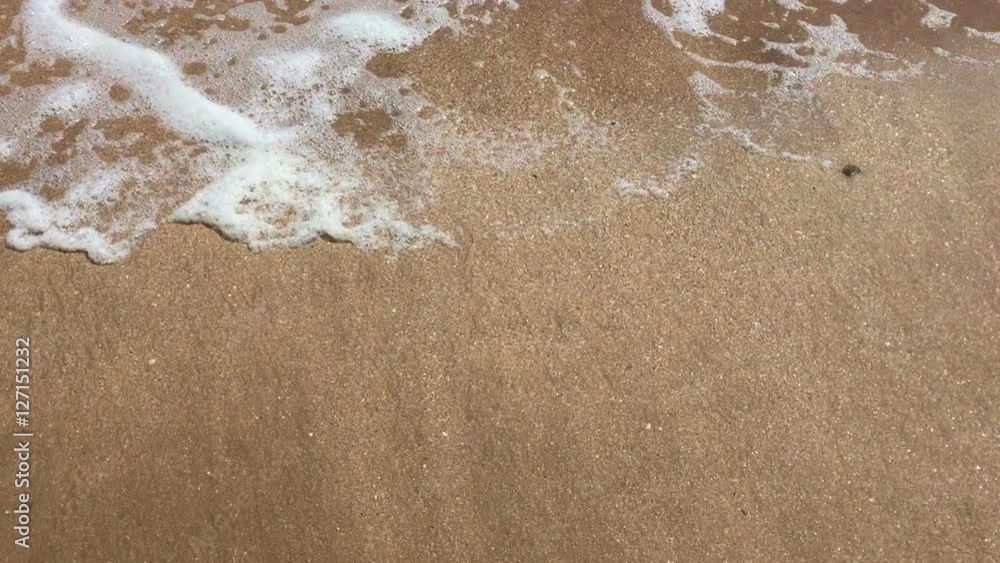 Soft wave of blue ocean on sandy beach. Soft wave of blue ocean on sandy beach.