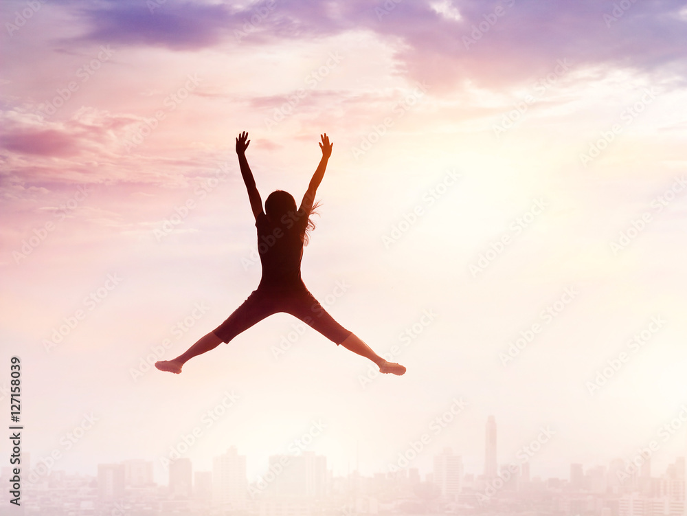 Woman enjoy jumping while chilling out on city sky, nature background Woman enjoy jumping while chilling out on city sky, nature background