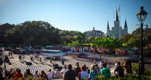 New Orleans, Louisiana, USA - street artists, spectators and traffic at Decatur St. in front of Saint Louis Cathedral and Jackson Square at sunny day - Timelapse without motion