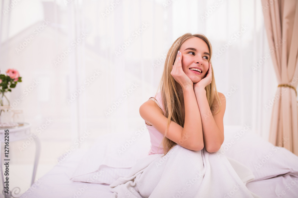 Young beautiful girl in morning bed with good mood Young beautiful girl in morning bed with good mood