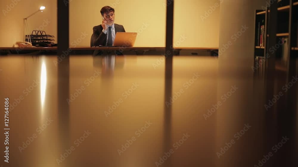 MS SELECTIVE FOCUS Businessman works on his lap top late at night / Singapore MS SELECTIVE FOCUS Businessman works on his lap top late at night / Singapore