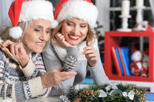 Принти на полотні Two women in santa hats